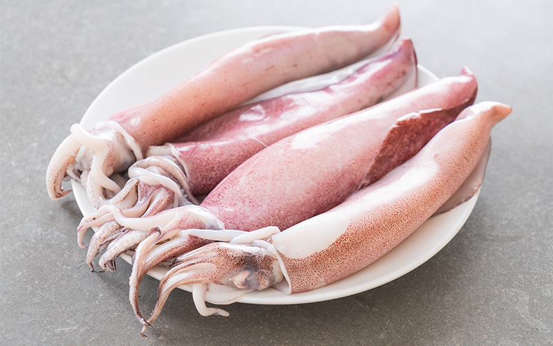 Fresh whole squid prepared for cleaning by CatchOfTheDaySG.
