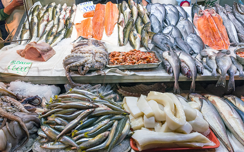 Fresh seafood selection on display at a wet market.