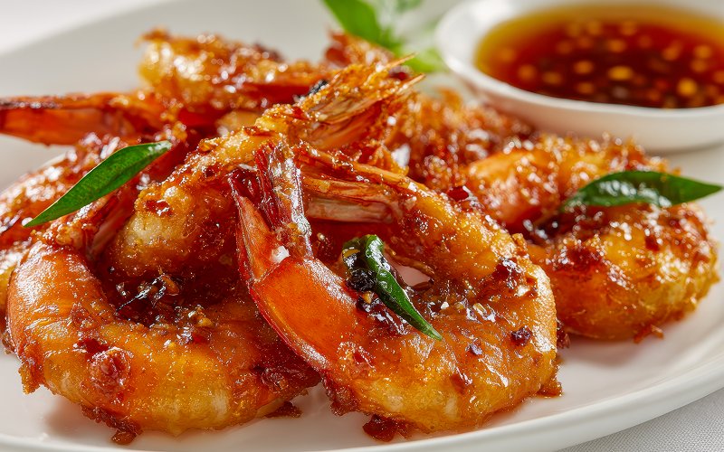 Crispy fried prawns served with a spicy dipping sauce.