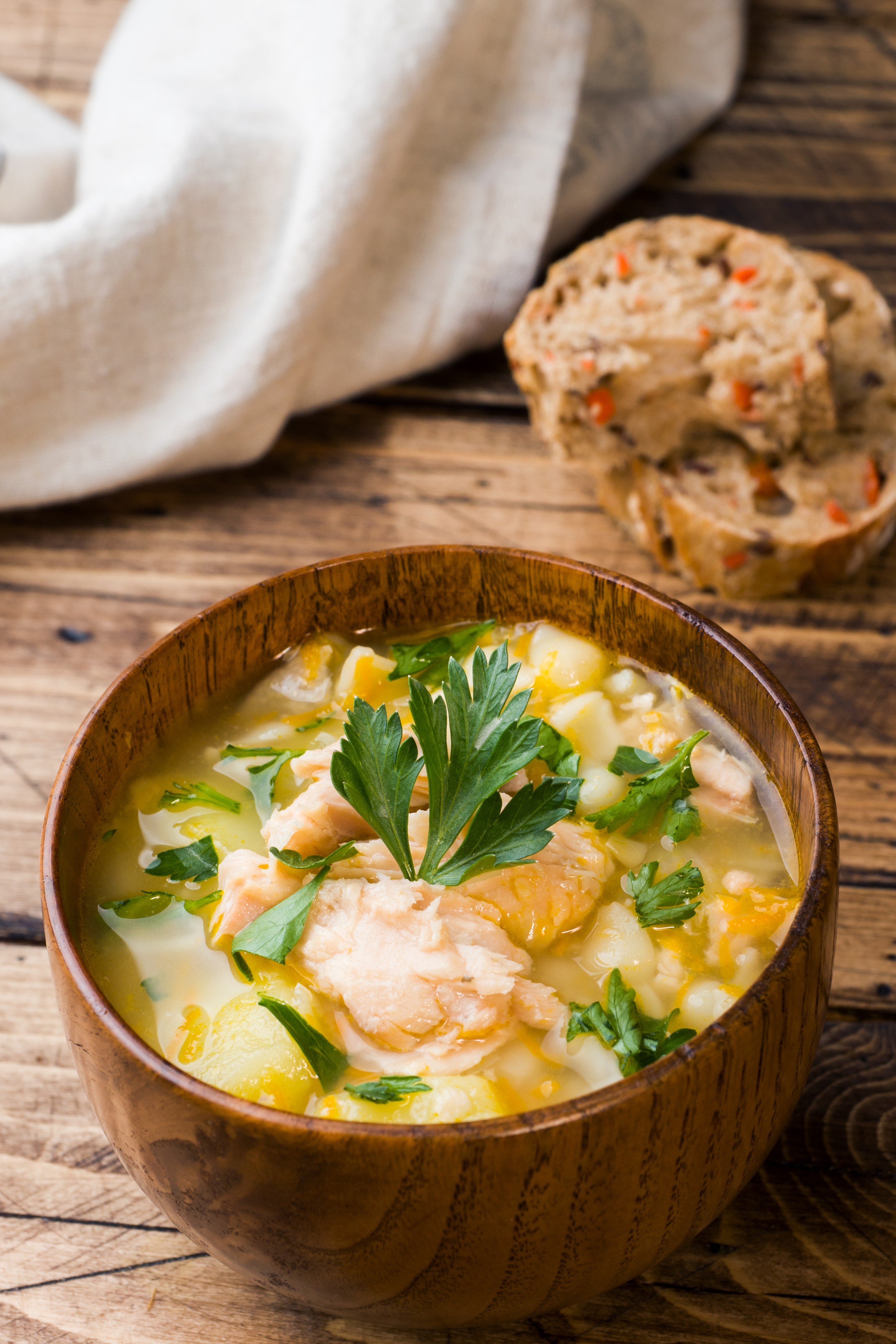 Bowl of fish soup with herbs